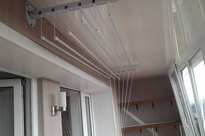 Настенная сушилка для белья на балкон (31 фото): балконная выдвижная и складная бельевая модель